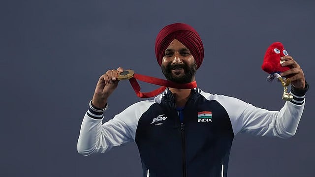 AP : Harvinder Singh celebrates on the podium after winning the men's individual recurve archery gold medal at Paris Paralympic Games 2024.